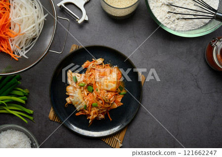 Top view traditional Korean Kimchi served on a plate. Korean cuisine and traditional side dish concept 121662247