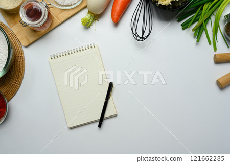 Fresh kimchi ingredient a blank notepad and pen for writing down recipes 121662285