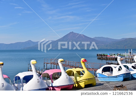 Colorful swan boats on Lake Shikotsu 121662536