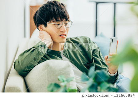 Men looking at smartphones Men looking at smartphones 121663984