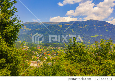 Wonderful wooded mountain alpine panorama with village and huts Austria. Wonderful wooded mountain alpine panorama with village and huts Austria. 121664584