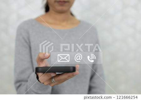 Concept of contact us. Person using smartphone finger point at contact icons. connection customer service. email, call, address. Chat message connect send and receive. 121666254
