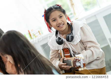 children guitar classroom education instrument music school childhood student learning. 121666453