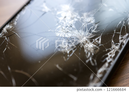 A smartphone with a broken screen when dropped A smartphone with a broken screen when dropped 121666684