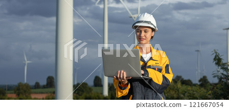Female engineer wind turbine worker survey operational planning windmill clean renewable energy technology for future. Alternative technology protect environment reduce global warming problems. Female engineer wind turbine worker survey operational planning windmill clean renewable energy technology for future. Alternative technology protect environment reduce global warming problems. 121667054