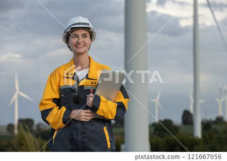 Female engineer wind turbine worker survey operational planning windmill clean renewable energy technology for future. Alternative technology protect environment reduce global warming problems. Female engineer wind turbine worker survey operational planning windmill clean renewable energy technology for future. Alternative technology protect environment reduce global warming problems. 121667056