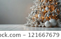 white christmas balls on wooden table 121667679