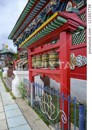 Buddhist prayer drums with mantras in Buddhist Monastery in Ivolginsky Datsan in Buryatia, Russia 121667736