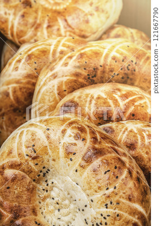 Uzbek Tajik Turkish traditional flatbreads, delicious oriental lavash bread Deliciously Freshly Baked Soft Bread Rolls with a Beautifully Golden and Crunchy Crust on Top 121667790