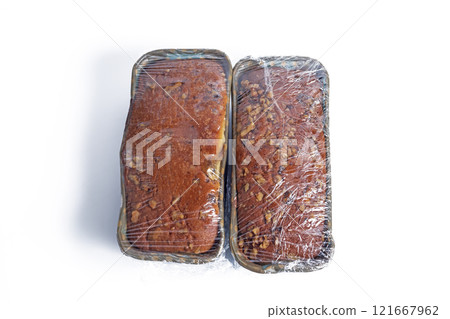 Freshly baked bread wrapped in plastic food packaging on a white background 121667962