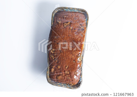 Freshly baked bread wrapped in plastic food packaging on a white background 121667963