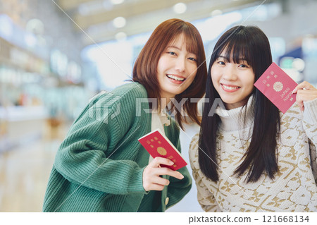 A woman with a passport 121668134