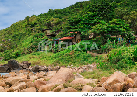 Ocean coastline with rain forest and houses in Brazil. 121668231