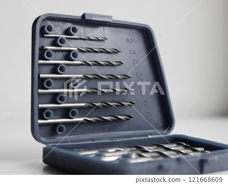 Opened lid of set box for drill bits storage studio isolated stock photo 121668609
