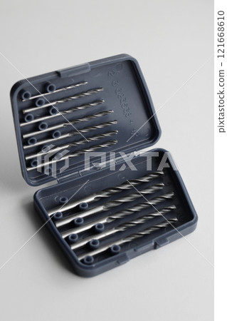 Variety size drill bits in plastic box with indicating the drill diameter in millimeters 121668610