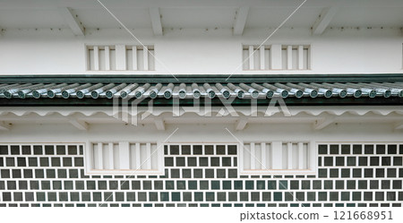 Stone wall texture background - old building techniques, geometric architecture, tiled roof Stone wall texture background - old building techniques, geometric architecture, tiled roof 121668951