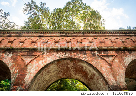 Old brick wall, beautiful curved brick design 121668980