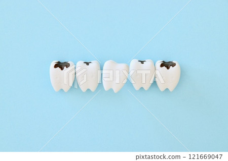 One healthy tooth remaining amongst all the decayed teeth One healthy tooth remaining amongst all the decayed teeth 121669047