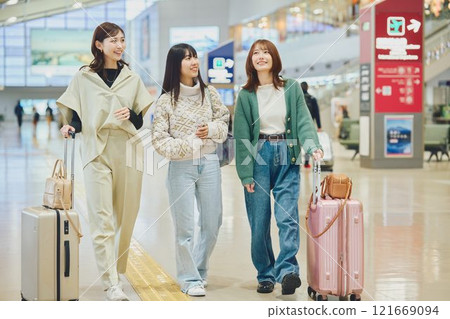 Woman walking in the airport 121669094