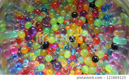 Heap Of Multicolor Water Balls On Curved Steel Surface Heap Of Multicolor Water Balls On Curved Steel Surface 121669125