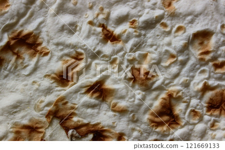 Homemade Freshly Baked Thin Laffa Bread Textured Stock Photo. Traditional bread backgrounds Homemade Freshly Baked Thin Laffa Bread Textured Stock Photo. Traditional bread backgrounds 121669133
