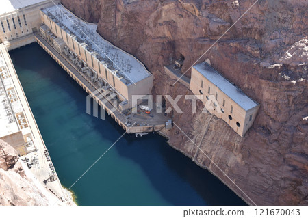 Hoover Dam, Hydroelectric power plant in Clark County, Nevada, industrial construction against the blue sky and mountains Hoover Dam, Hydroelectric power plant in Clark County, Nevada, industrial construction against the blue sky and mountains 121670043