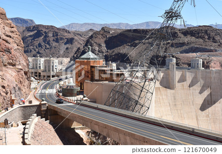 Hoover Dam, Hydroelectric power plant in Clark County, Nevada, industrial construction against the blue sky and mountains Hoover Dam, Hydroelectric power plant in Clark County, Nevada, industrial construction against the blue sky and mountains 121670049