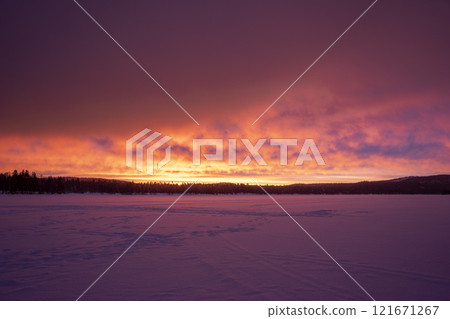 Red sunrise at noon in Lapland Inari Nellin Lake 121671267