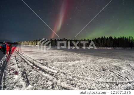 Snowmobile expedition Aurora Northern Lights in Lapland Inari Nellin Lake forest Snowmobile expedition Aurora Northern Lights in Lapland Inari Nellin Lake forest 121671286