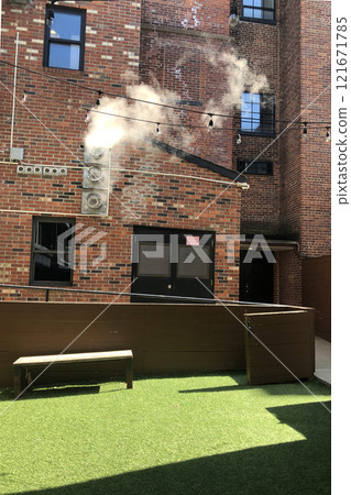 Loft courtyard with brick walls Loft courtyard with brick walls 121671785