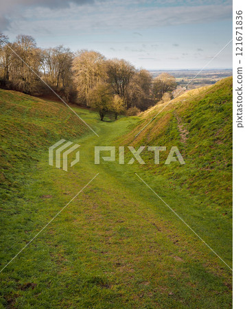 Walking down Kingstone Coombes dry valley, Ashbury in the distance, Oxfordshire 121671836