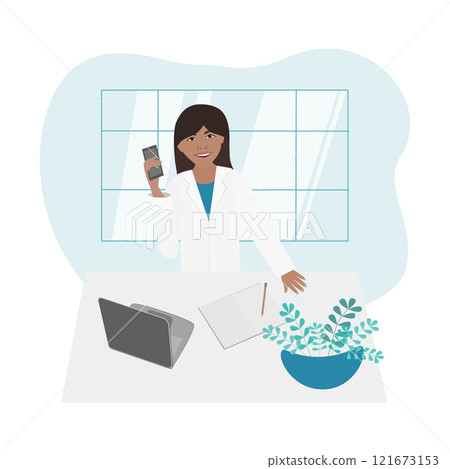 Medical worker woman in white coat, with phone standing at table 121673153