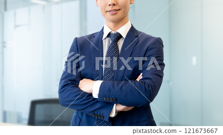 Male businessman folding his arms 121673667