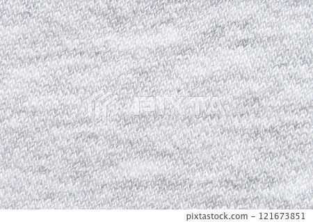 Close up of white knitted wool texture with soft fabric pattern for cozy 121673851
