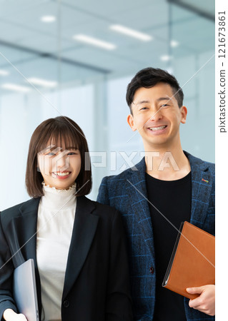 Image of business teamwork between two men and women 121673861
