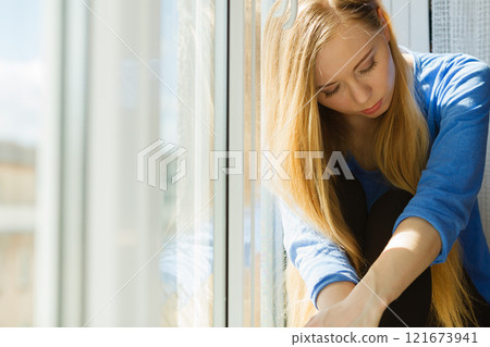 Young teenage sad woman Young teenage sad woman 121673941