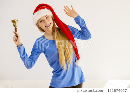 Christmas woman holding bell. Christmas woman holding bell. 121674057