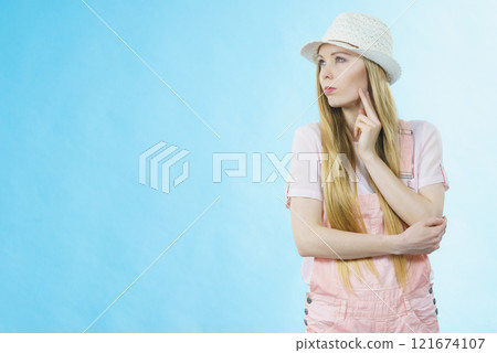 Cute teenage woman thinking Cute teenage woman thinking 121674107