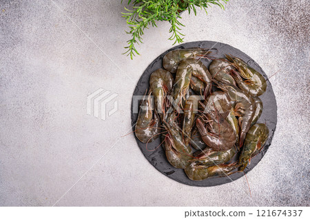 Fresh uncooked prawns or shrimps 121674337