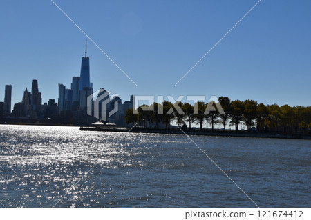 View of the skyscrapers of Manhattan from the water, New York landscape from the waterfront View of the skyscrapers of Manhattan from the water, New York landscape from the waterfront 121674412