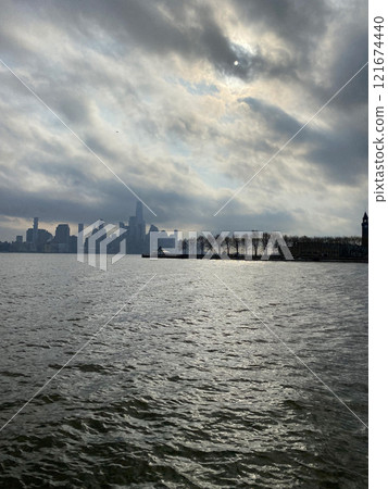 View of the skyscrapers of Manhattan from the water, New York landscape from the waterfront View of the skyscrapers of Manhattan from the water, New York landscape from the waterfront 121674440