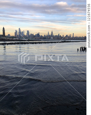 View of the skyscrapers of Manhattan from the water, New York landscape from the waterfront 121674556