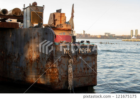 Old rusty barge ladder moored in New York City Old rusty barge ladder moored in New York City 121675175