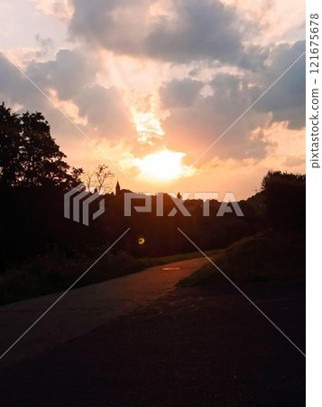 Sunset over the summer sky. A small village in Germany 121675678