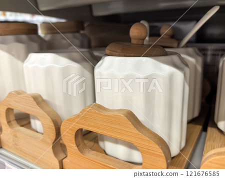 Stylish ceramic containers enhance kitchen organization and decor 121676585