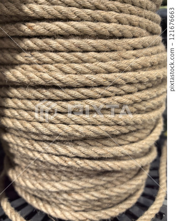 Coiled natural fiber rope on a spool ready for various applications 121676663