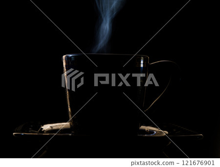 Steaming coffee in a cup Steaming coffee in a cup 121676901
