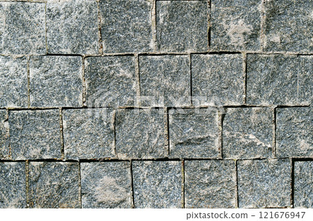 Stone texture. Old stonework. Garden wall. The streets of the old city are paved with stones. 121676947