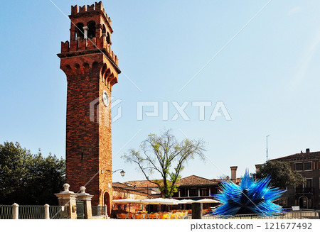 Italy, Venice Lagoon, Murano Island, Clock Tower and Glass Sculpture Italy, Venice Lagoon, Murano Island, Clock Tower and Glass Sculpture 121677492