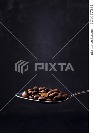 The concept of fragrant hot coffee with spices. Autumn, winter, cold season. Hot drinks. Coffee on a dark background. 121677581